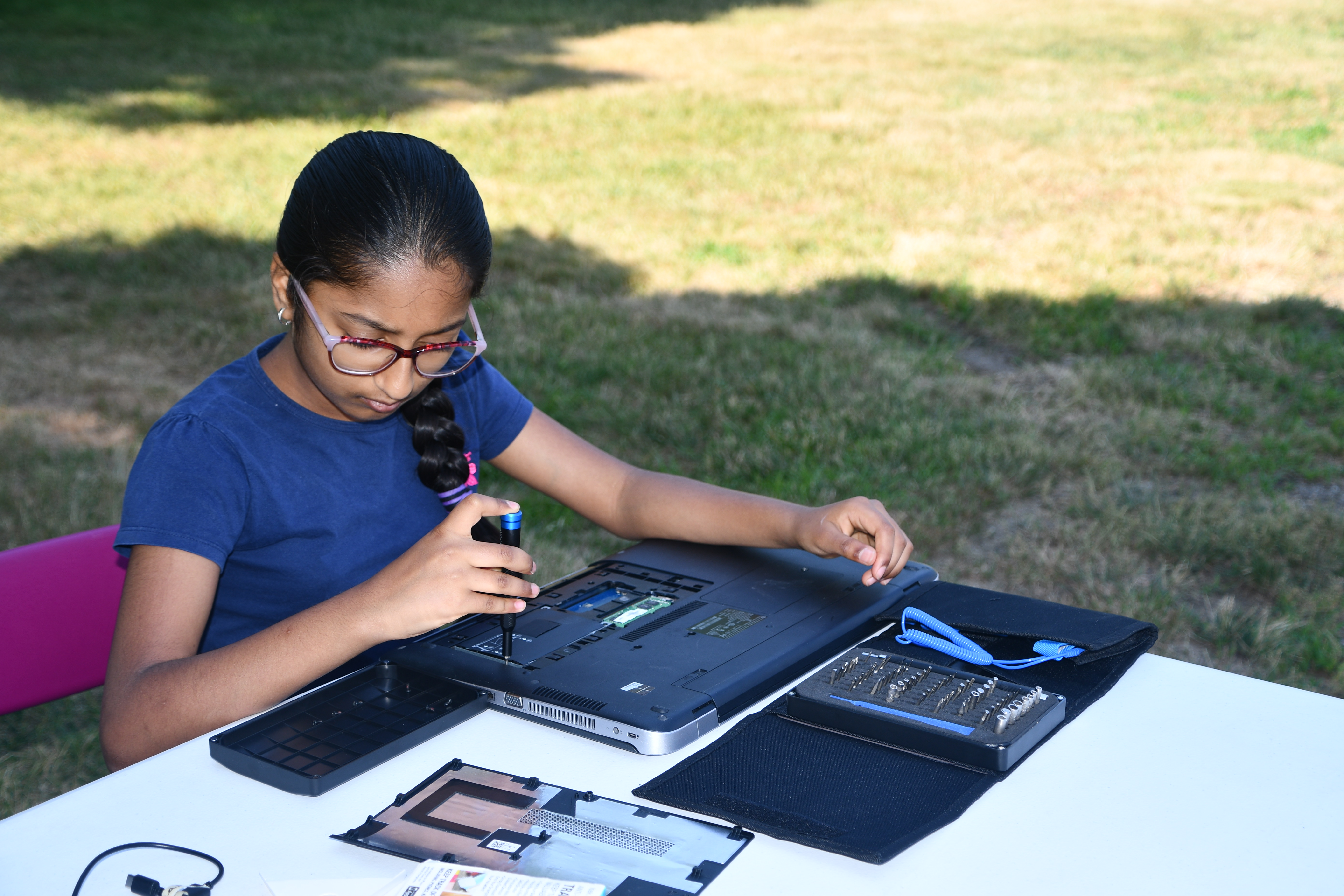 Laptop teardown outdoors on a folding table
