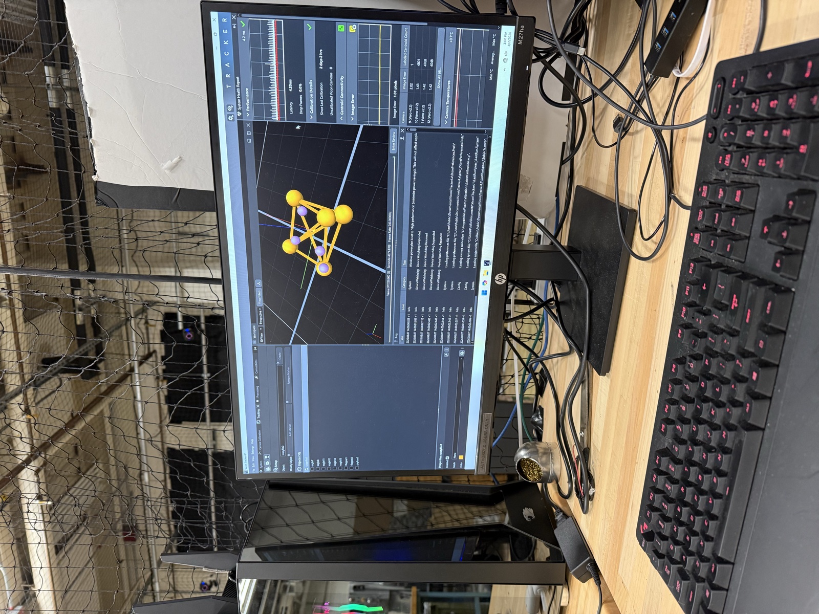 Monitor showing a drone frame CAD model in Onshape