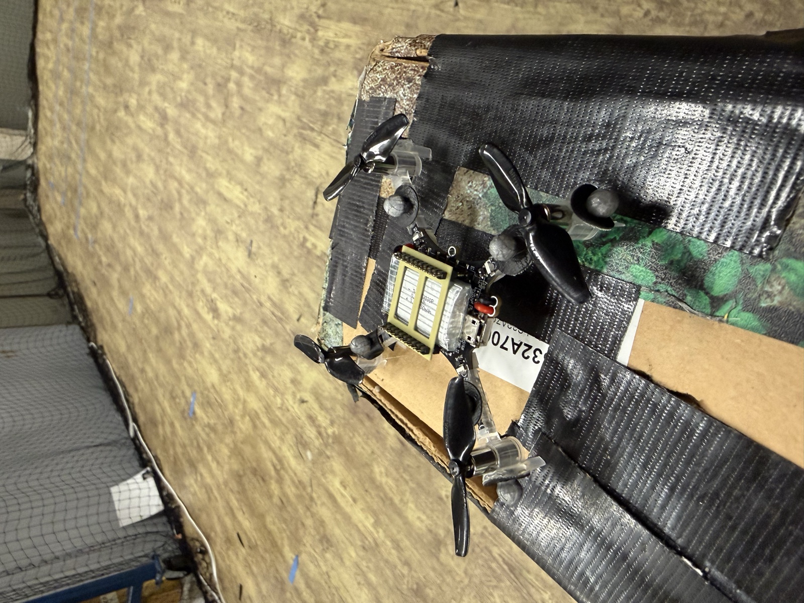 Duct-taped quadcopter drone frame prototype with motors mounted