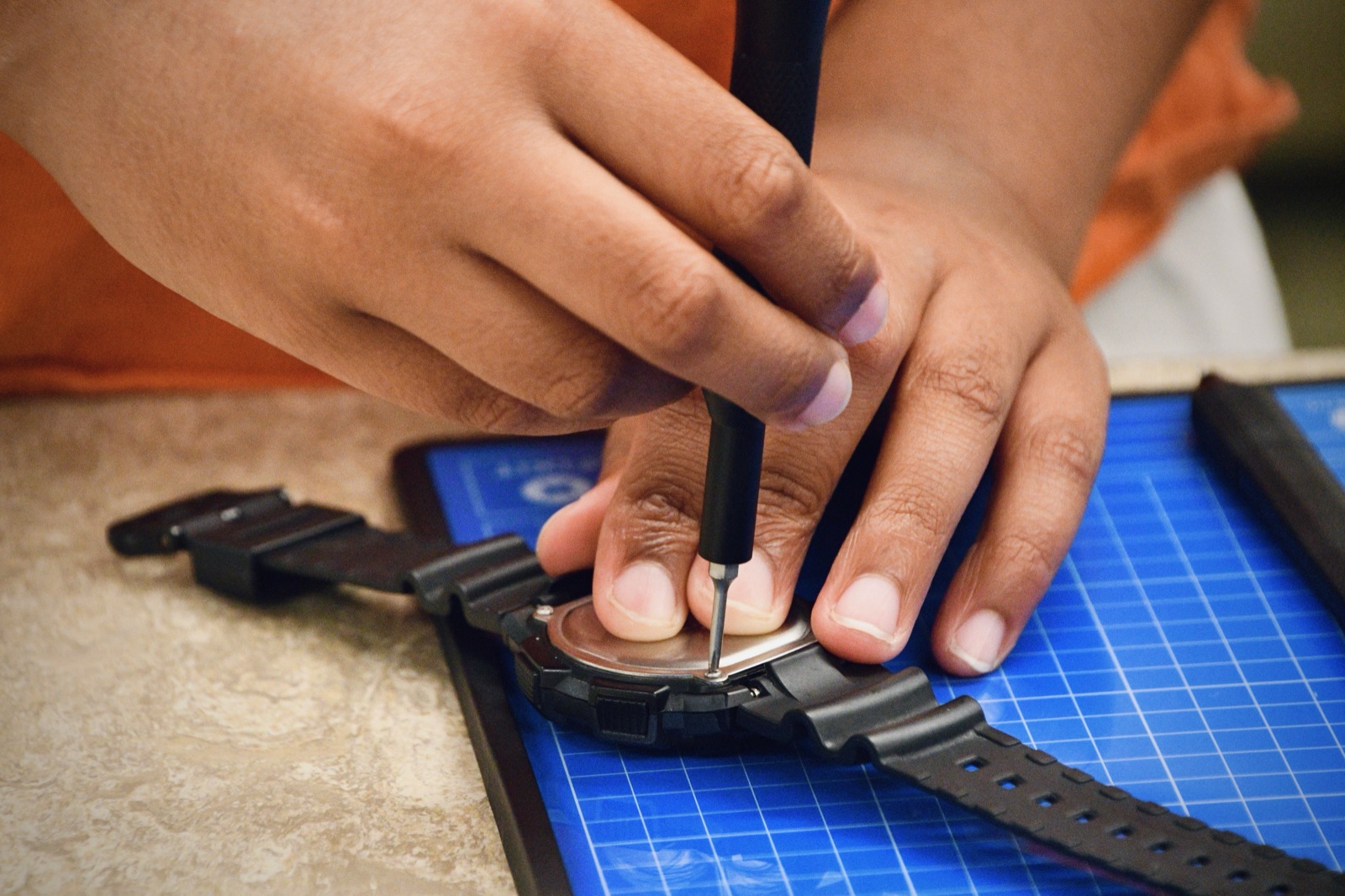 Replacing a watch battery with a precision driver